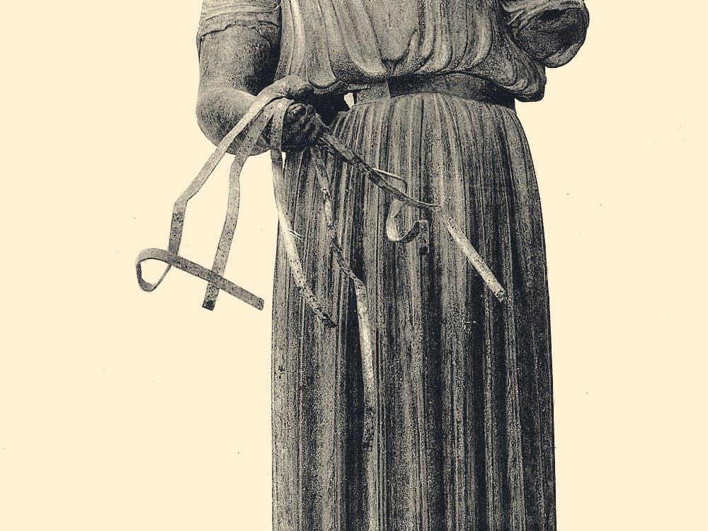 Duotone photograph of a bronze charioteer\u2019s hands holding the reins